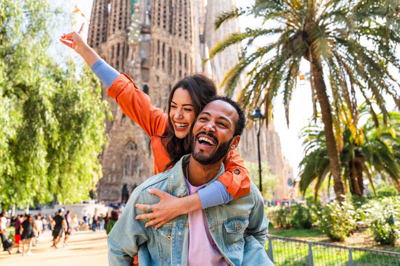 Couple smiling while traveling through Europe